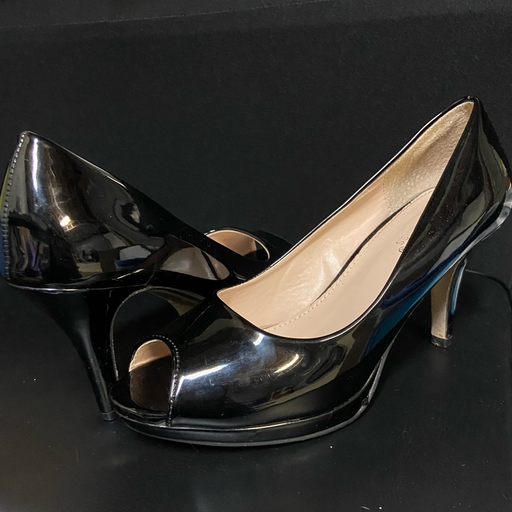 Shiny black open toe heels